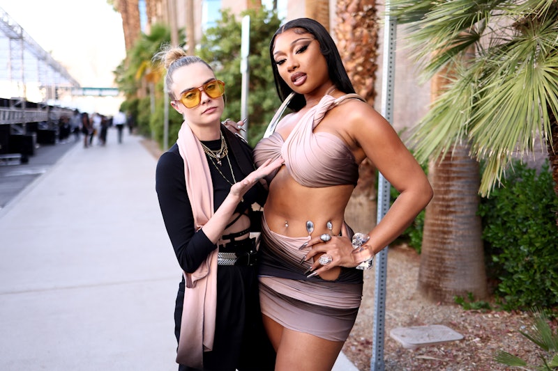 LAS VEGAS, NEVADA - MAY 15: (L-R) Cara Delevingne and Megan Thee Stallion attend the 2022 Billboard ...