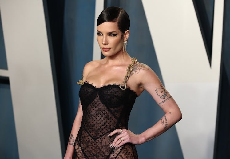 Halsey, who attended the 2022 Vanity Fair Oscar Party, revealed abortion saved their life after thre...