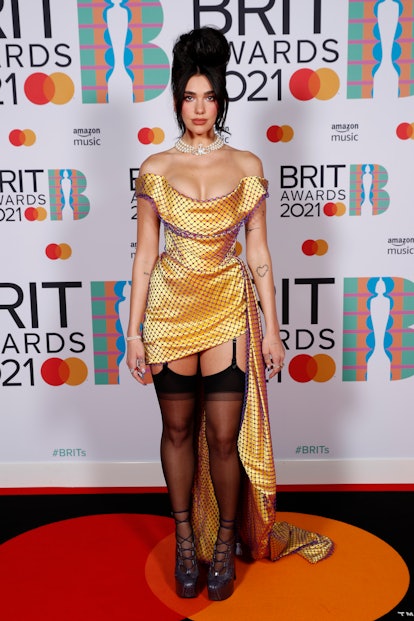 Dua Lipa wearing a custom Vivienne Westwood dress and shoes at the 2021 Brit Awards.