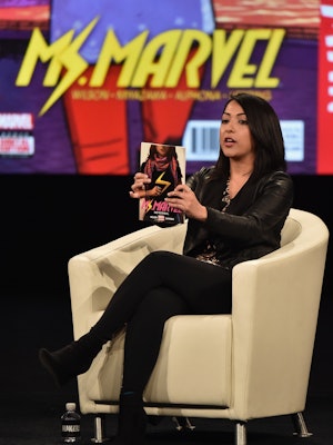 Sana Amanat holding the comic book 'Ms. Marvel,' which is part of the MCU.