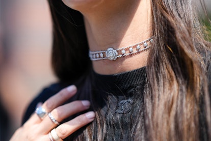 PARIS, FRANCE - JULY 05: Leia Sfez wears a silver and diamonds flower pattern necklace from Chanel, ...