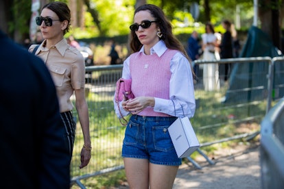 PARIS, FRANCE - JULY 05: A guest is seen wearing pink knit, denim shorts outside Chanel outside Pari...