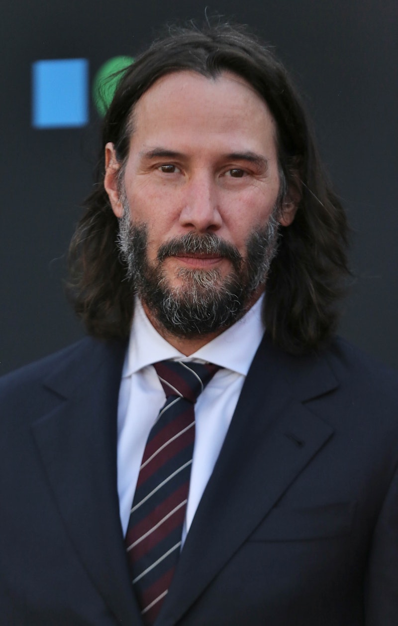 Keanu Reeves' airport moment with a fan went viral. Photo via Getty Images