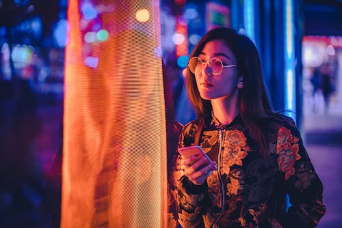 Woman looks at a screen. These zodiac signs will be most affected by the July 2022 full Buck moon.