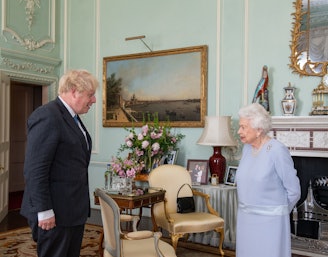 LONDON, ENGLAND - JUNE 23: Queen Elizabeth II greets Prime Minister Boris Johnson during the first i...