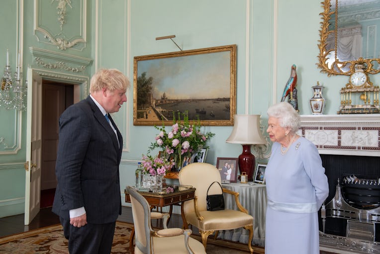 LONDON, ENGLAND - JUNE 23: Queen Elizabeth II greets Prime Minister Boris Johnson during the first i...