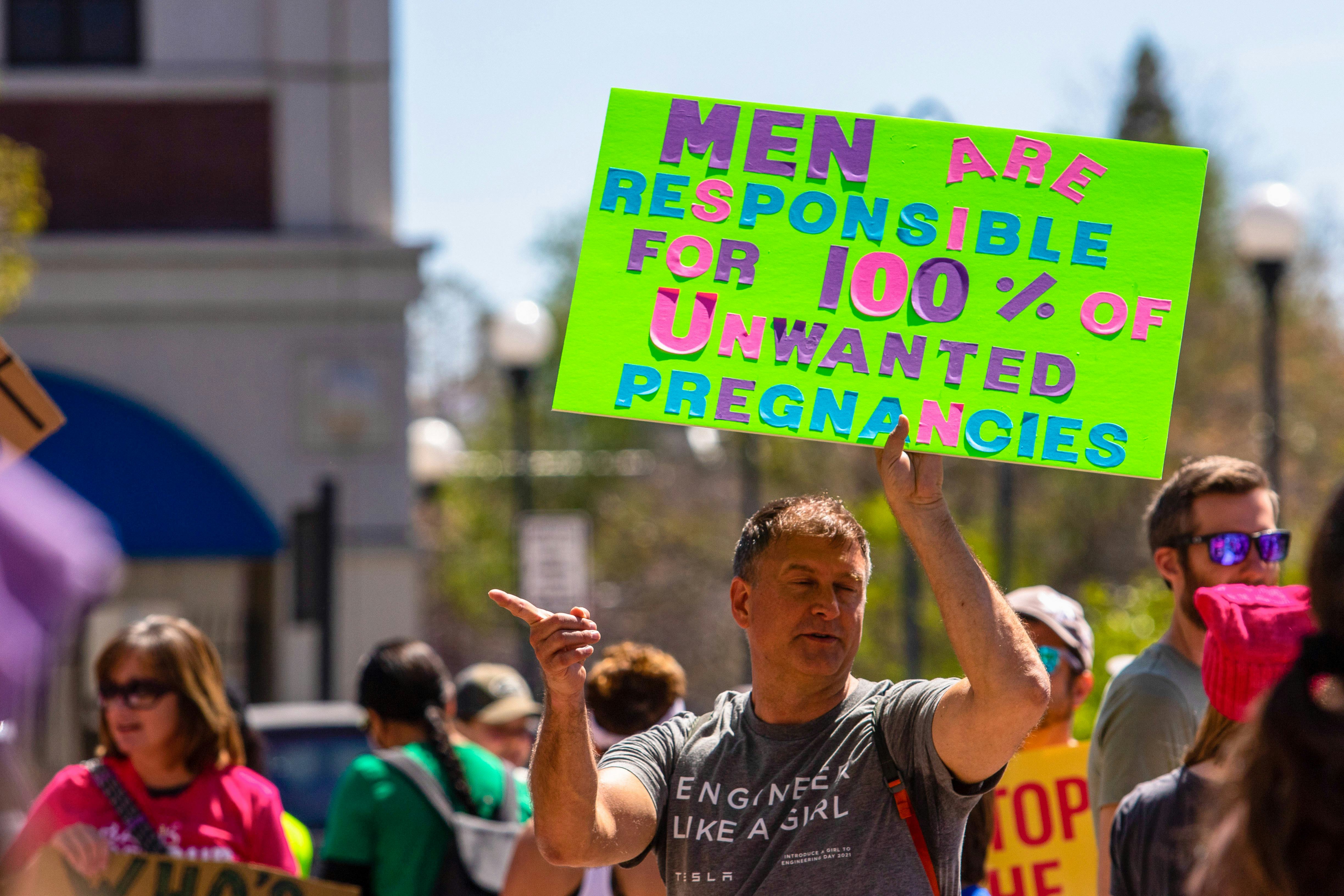 RENO, NEVADA, UNITED STATES - 2022/05/14: A protester holds a placard saying, "men are responsible f...