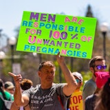 RENO, NEVADA, UNITED STATES - 2022/05/14: A protester holds a placard saying, "men are responsible f...