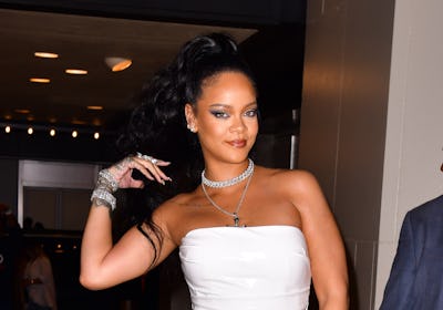 Rihanna in a white dress and winged eyeliner 