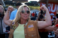 PLAINVILLE, GEORGIA - MAY 20: Rep. Marjorie Taylor Greene (R-GA) flexes her muscles during a Bikers ...