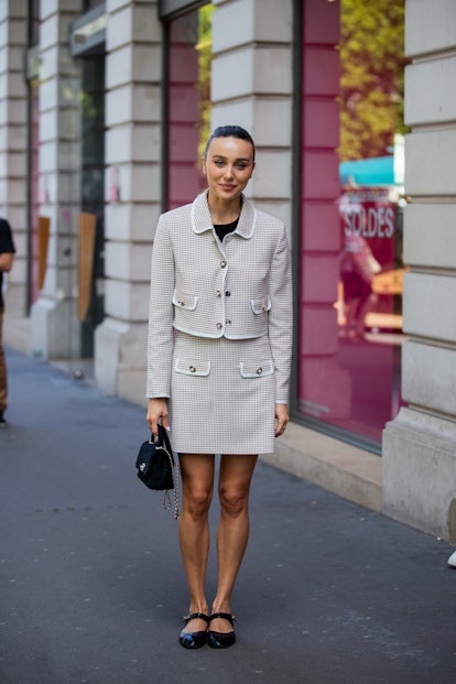 PARIS, FRANCE - JULY 06: Mary Leest seen wearing grey button up blazer, mini skirt with pockets, Cha...