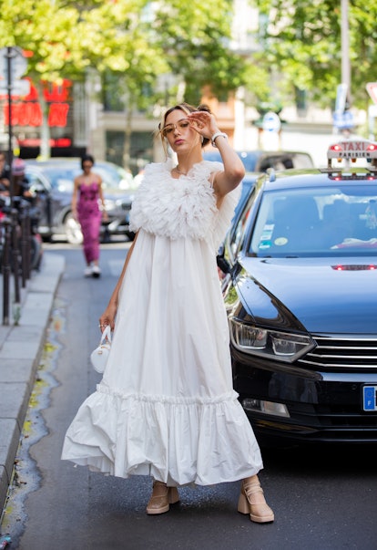 PARIS, FRANCE - JULY 06: Eileen Vu seen with pigtails wearing white dress outside Viktor&Rolf during...