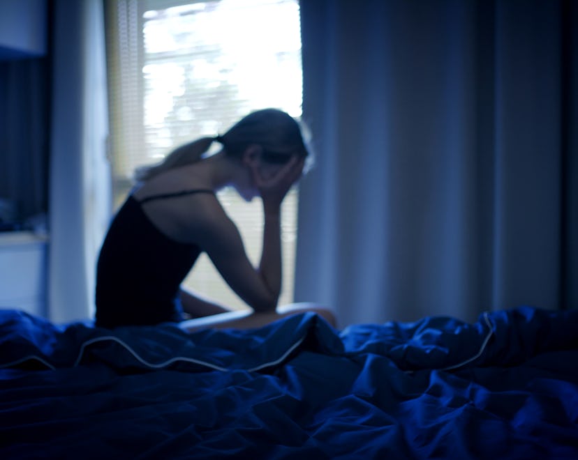woman in bed wondering what the most common stress dreams are and what they mean