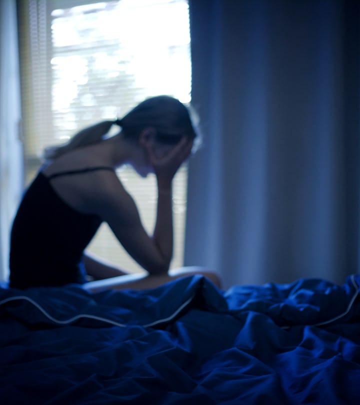 woman in bed wondering what the most common stress dreams are and what they mean