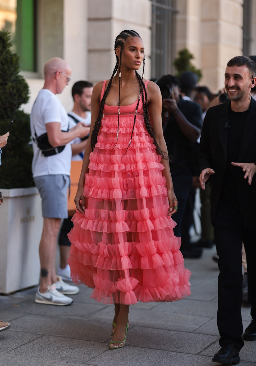 PARIS, FRANCE - JULY 04: Cindy Bruna seen wearing a pink/coral ruffled long dress and green high hee...