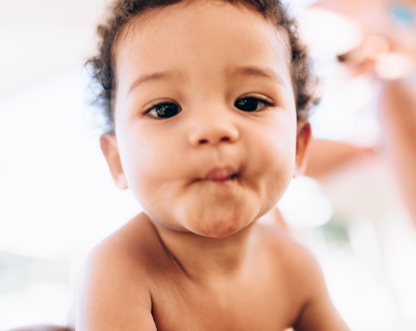 Portrait of a cute baby looking at camera, unique girl names that start with u