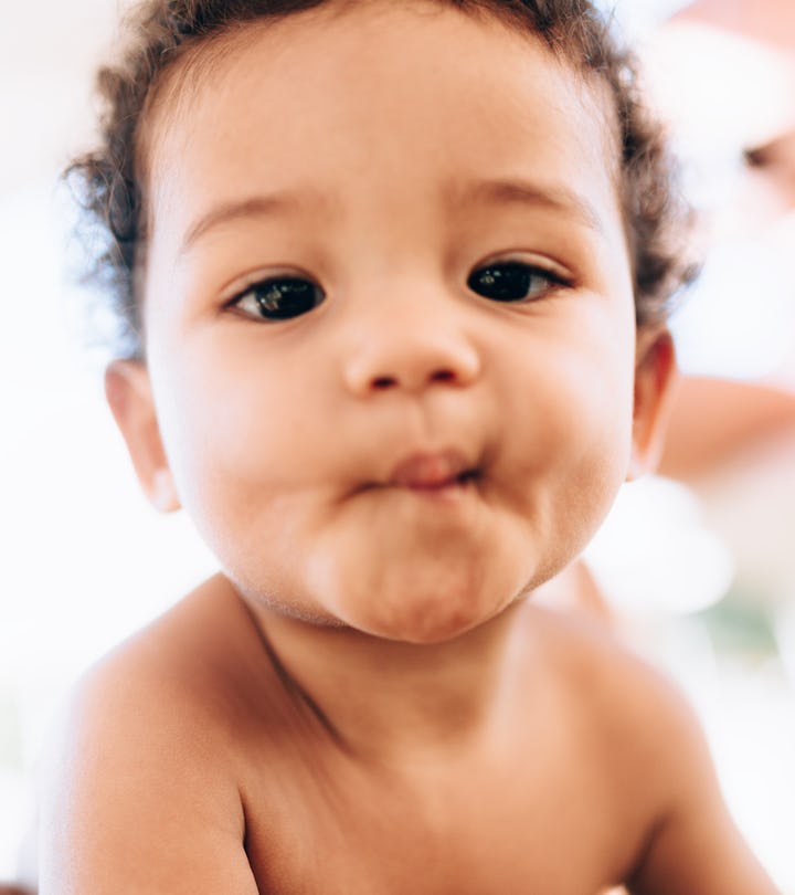 Portrait of a cute  baby looking at camera, unique girl names that start with u 