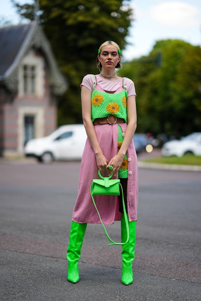 PARIS, FRANCE - JULY 05: Rose BLM wears gold and green earrings, a gold large chain necklace, neon g...