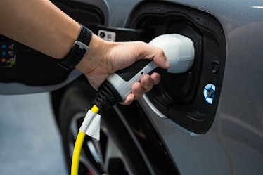 Hand charging modern electric car