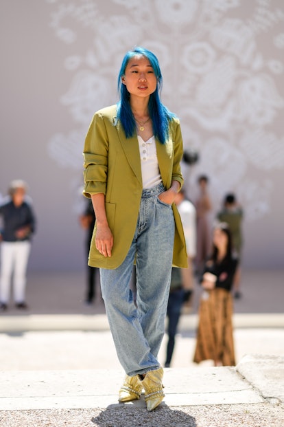 PARIS, FRANCE - JULY 04: Margaret Zhang wears gold chain necklace, a white ribbed / buttoned neck t-...