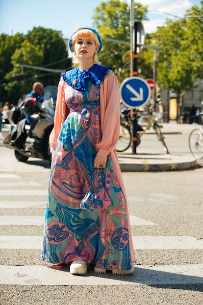 PARIS, FRANCE - JULY 05: A guest wears a blue hat, pink and blue and green eclectic multi-paisley st...