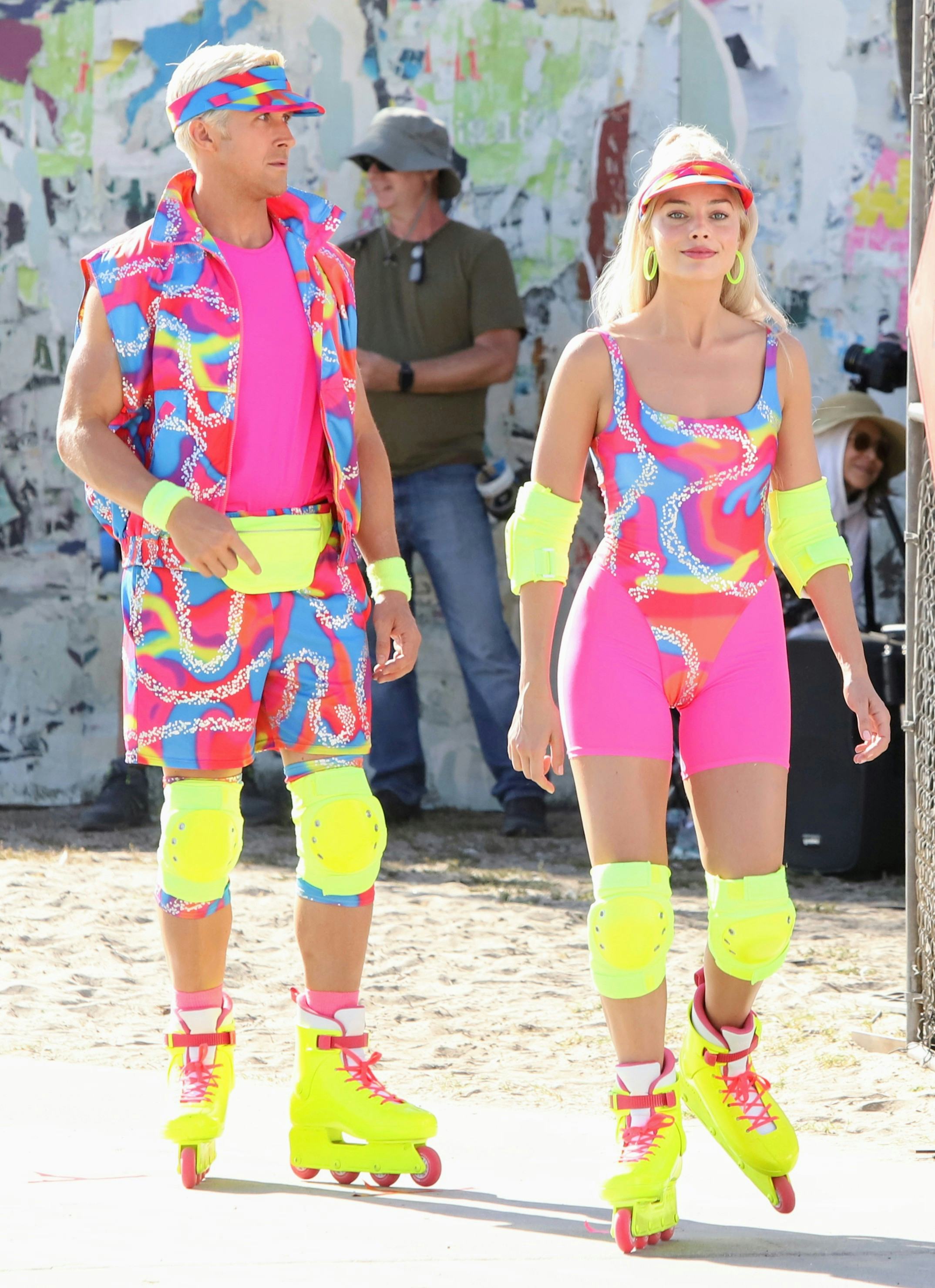 Margot Robbie and Ryan Gosling dressed up as Barbie and Ken seen rollerblading on the set of "Barbie...