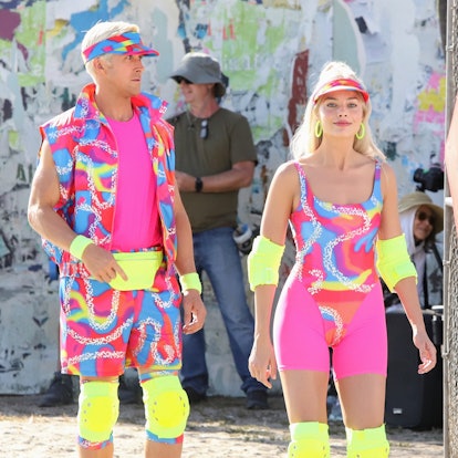 Margot Robbie and Ryan Gosling dressed up as Barbie and Ken seen rollerblading on the set of "Barbie...