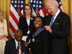 These photos of Simone Biles and Megan Rapinoe's Medal Of Freedom ceremony are too cute.