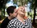 Lesbian couple embracing at park