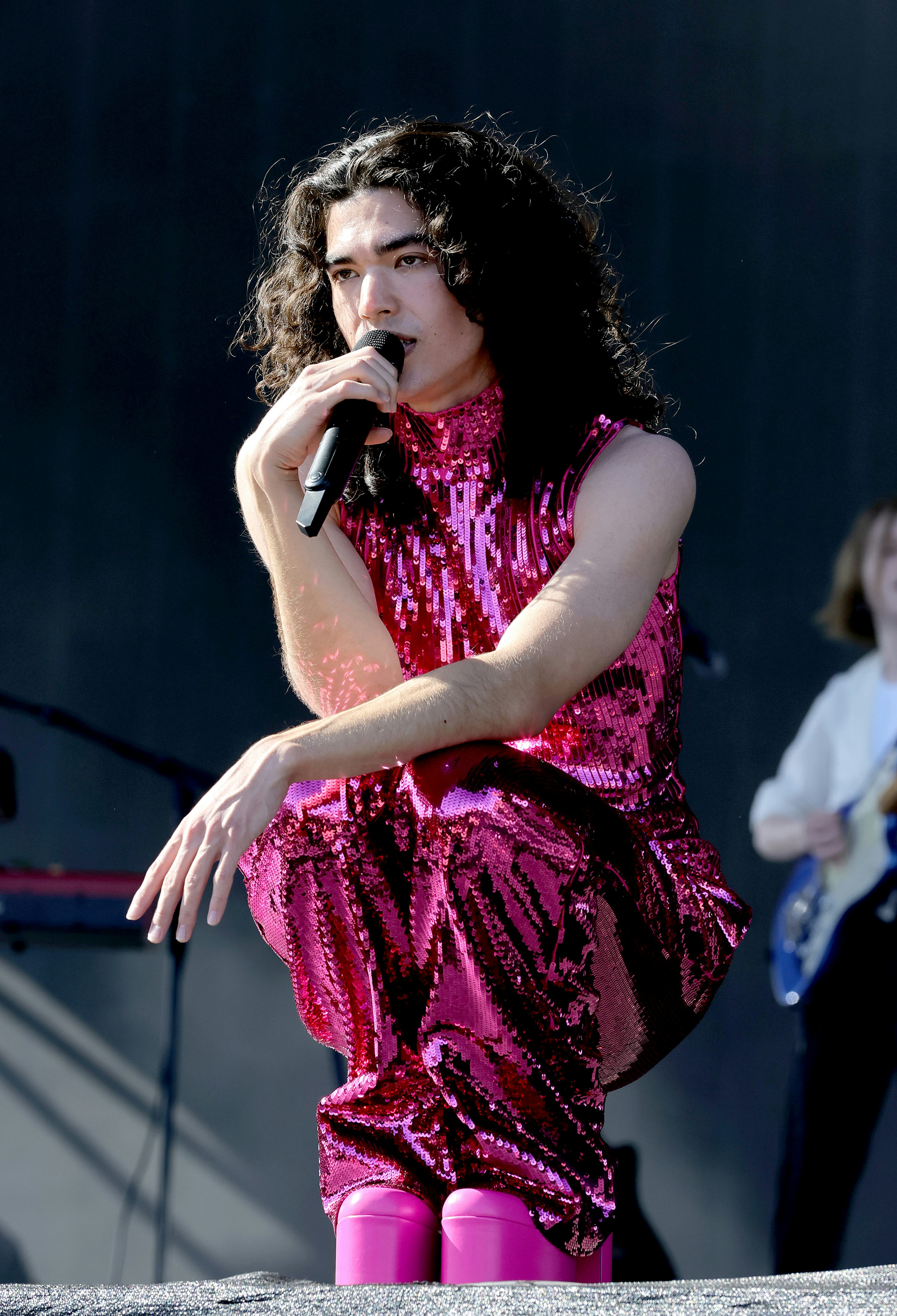 Conan Gray performing at Coachella in a pink sequin look