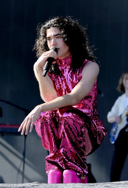 conan gray performing at coachella in a pink sequin look