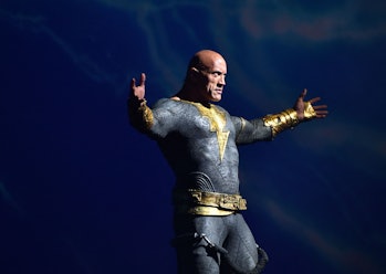 Actor Dwayne Johnson arrives on stage to present his film "Black Adam" during the Warner Bros. panel...