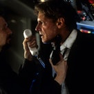 Gary Oldman aiming gun at Harrison Ford in a scene from the film 'Air Force One', 1997. (Photo by Co...