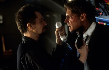 Gary Oldman aiming gun at Harrison Ford in a scene from the film 'Air Force One', 1997. (Photo by Co...