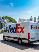 Federal Express delivery truck  in the courtyard at a condo complex in Falmouth, MA on Cape Cod.