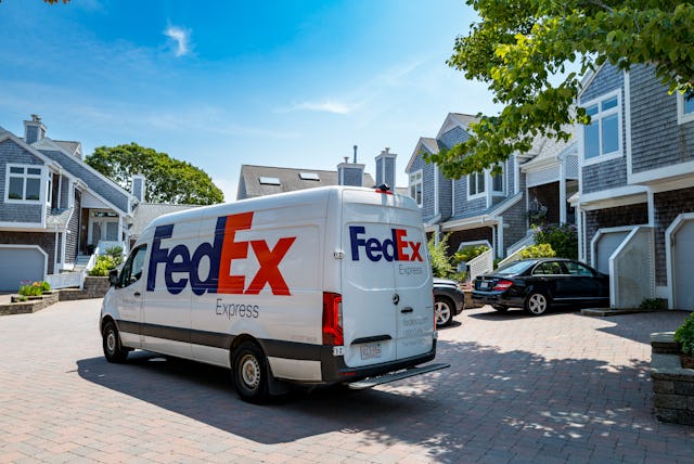Federal Express delivery truck in the courtyard at a condo complex in Falmouth, MA on Cape Cod.