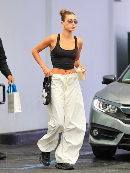 Hailey Bieber is seen wearing the Jaded London parachute pants going viral on TikTok in the Ecru col...