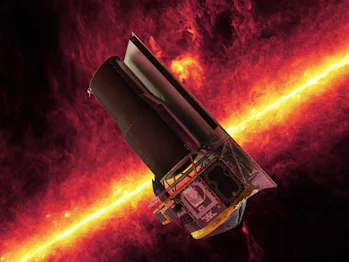 Spitzer seen against the infrared sky. The band of light is the glowing dust emission from the Milky...