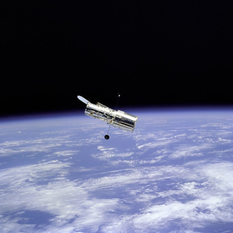 Hubble Space Telescope and Earth Limb, 1997. Flyaround of the Hubble Space Telescope (HST) after dep...