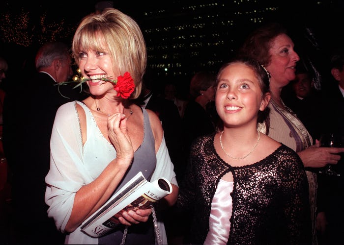 LS.Opera2.0908.GM Singer/actress Olivia NewtonJohn strikes a "Carmenlike" pose standing next to her...