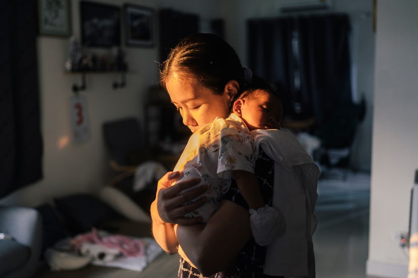 a mom and newborn baby in the evening or early morning light, snuggling. reasons why some women can'...