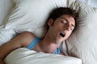 A man sleeping with his mouth open.