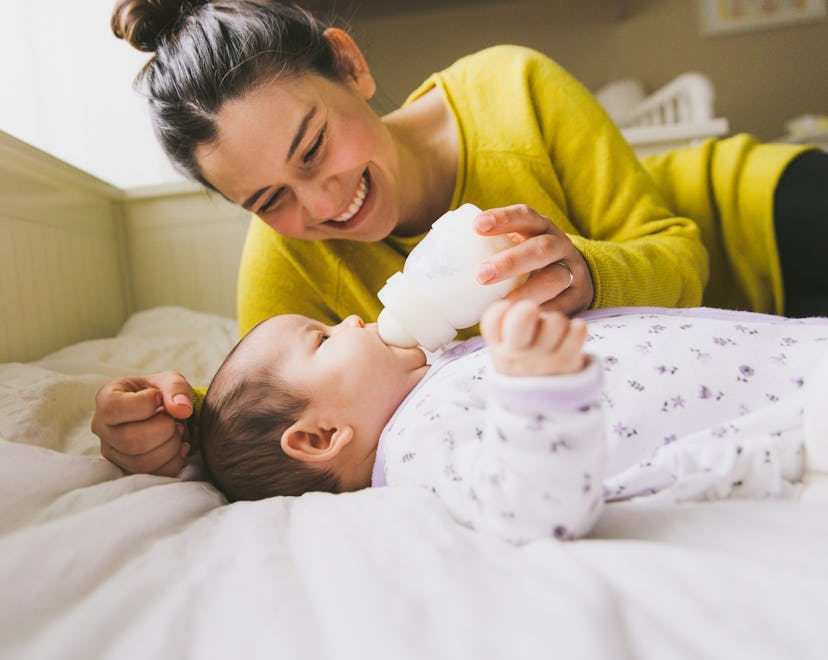 Mom feeding baby from bottle