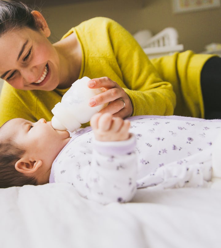 Mom feeding baby from bottle