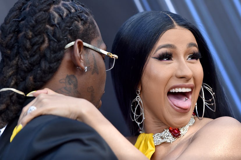 Offset and Cardi B attend the 2019 Billboard Music Awards. Cardi had a tongue piercing