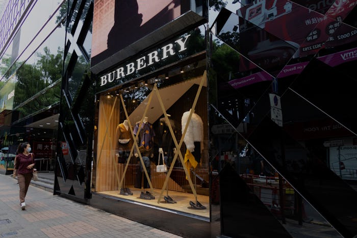 Hong Kong - October 12, 2021 :  Windows of the Burberry are taped in preparation for typhoon Kompasu...