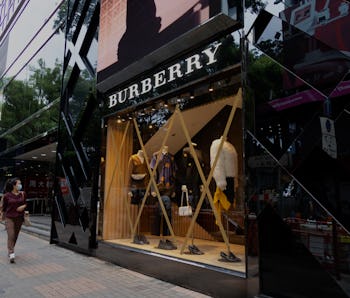 Hong Kong - October 12, 2021 :  Windows of the Burberry are taped in preparation for typhoon Kompasu...