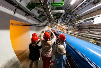 MEYRIN, SWITZERLAND - SEPTEMBER 14: Visitors take pictures at the tunnels at the Point 4 section dur...