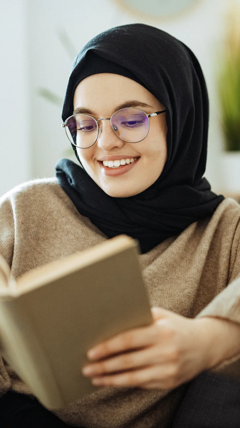 Beautiful millennial woman at home smiling