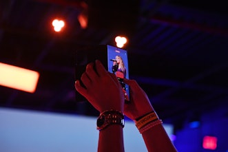 NEW YORK, NEW YORK - AUGUST 10: A Samsung phone captures Sabrina Carpenter performing at the Samsung...